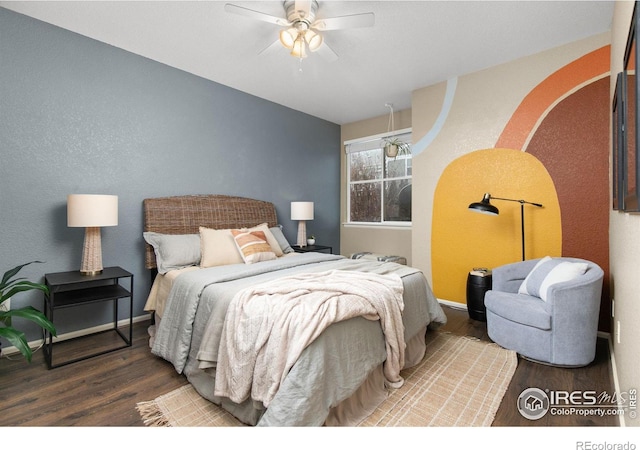 bedroom with wood-type flooring and ceiling fan