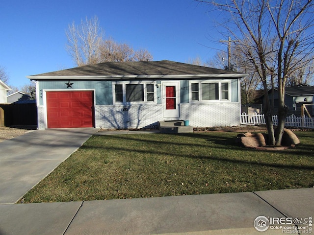 ranch-style home with a front yard and a garage