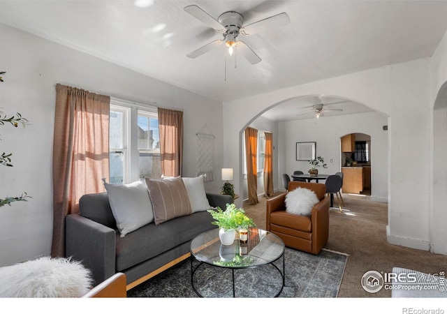 carpeted living room featuring ceiling fan