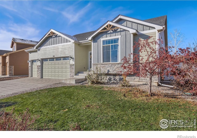 view of front of home featuring a garage and a front lawn