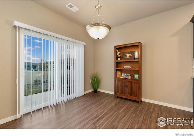 empty room featuring dark hardwood / wood-style floors