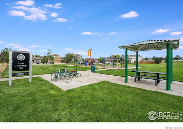 view of community featuring a playground, a gazebo, and a yard