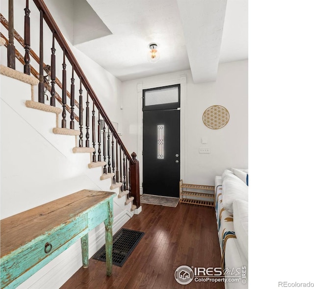 entrance foyer featuring dark wood-type flooring