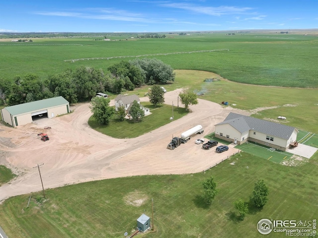 birds eye view of property with a rural view