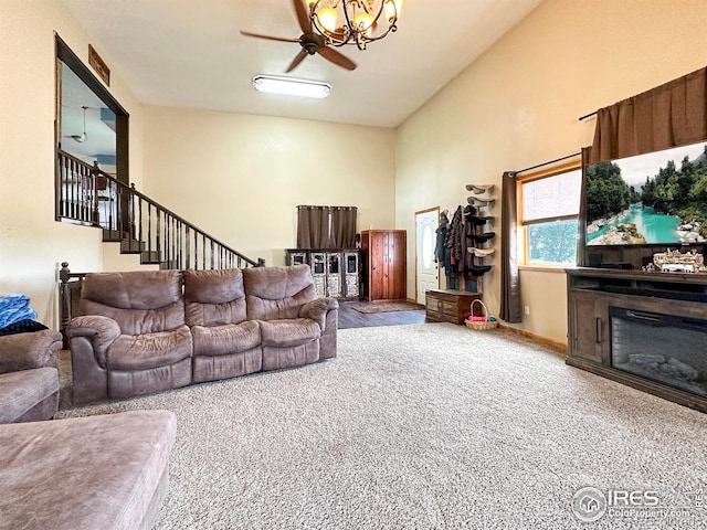 carpeted living room with ceiling fan