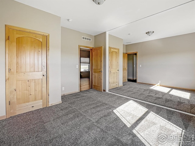 unfurnished bedroom featuring carpet floors