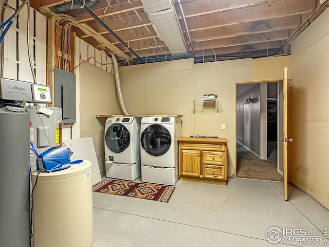 washroom with washing machine and clothes dryer and electric panel