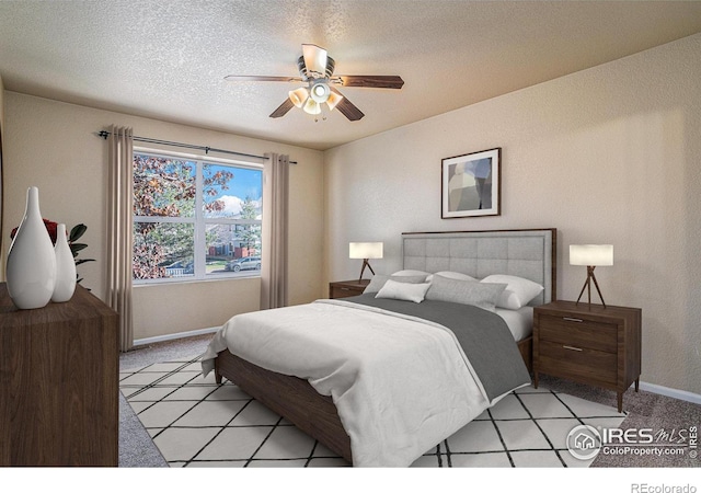 bedroom with a textured ceiling, light colored carpet, and ceiling fan