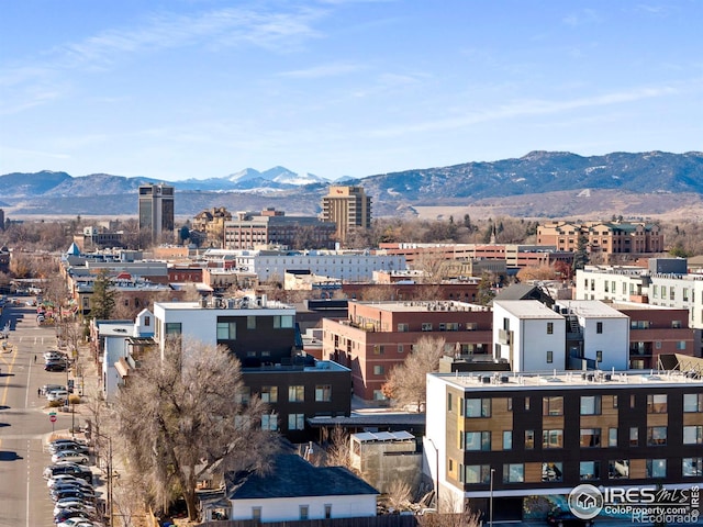 property's view of city with a mountain view