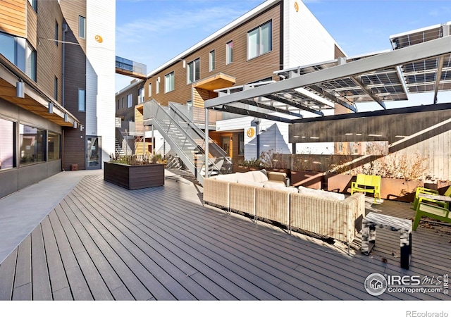 wooden terrace featuring an outdoor hangout area