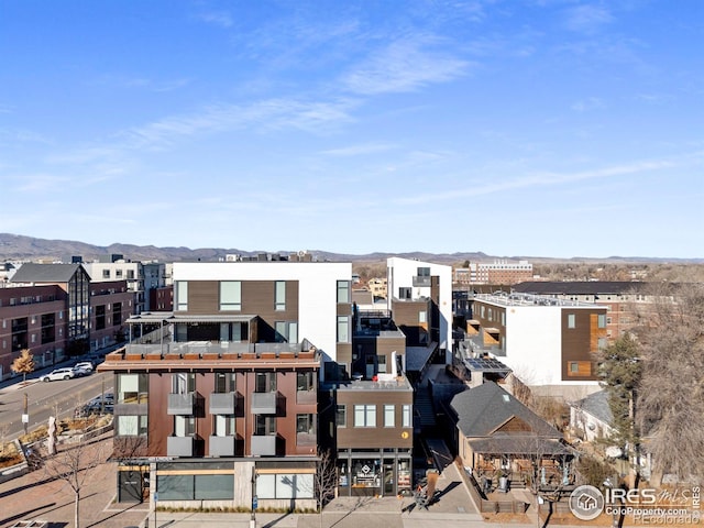 property's view of city featuring a mountain view