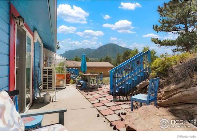 view of patio / terrace featuring a mountain view