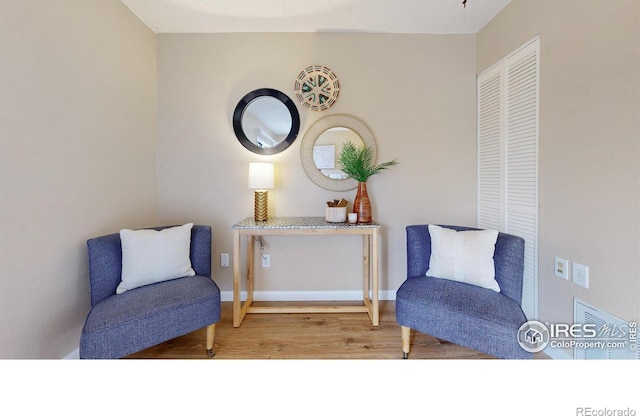 living area featuring hardwood / wood-style flooring