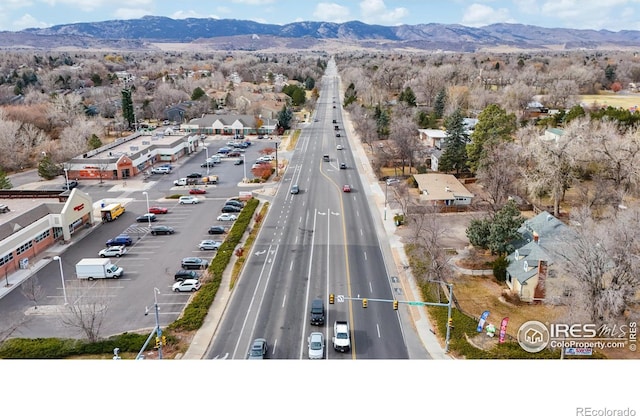 birds eye view of property featuring a mountain view