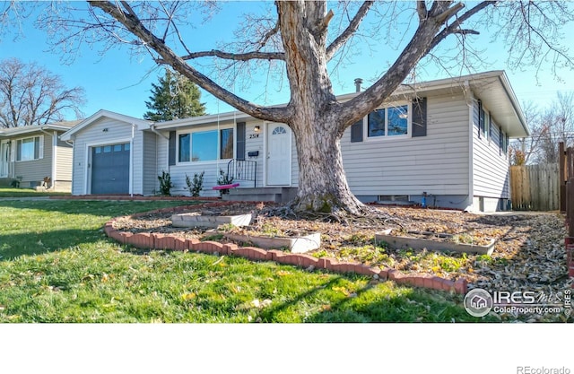 ranch-style home with a front yard and a garage