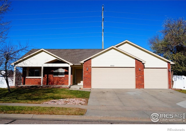 single story home featuring a garage and a front lawn