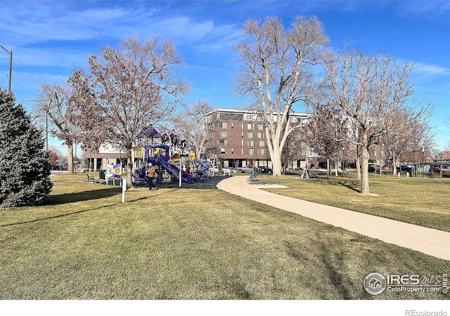 view of home's community with a playground and a yard