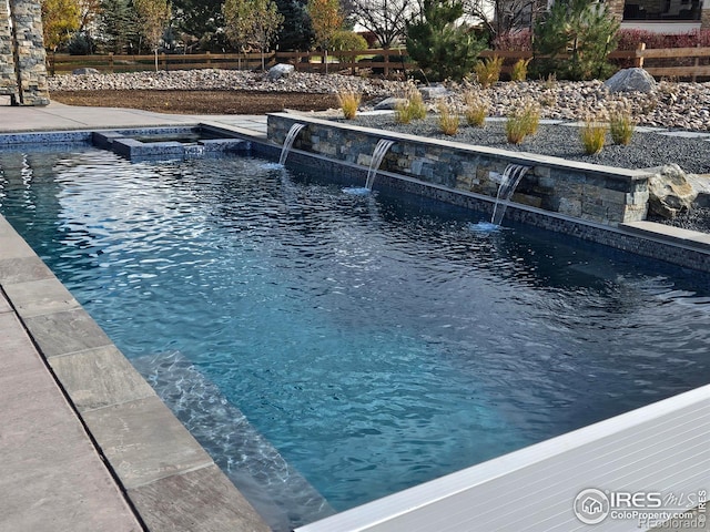 outdoor pool with an in ground hot tub