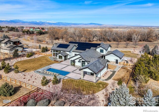 birds eye view of property featuring a mountain view