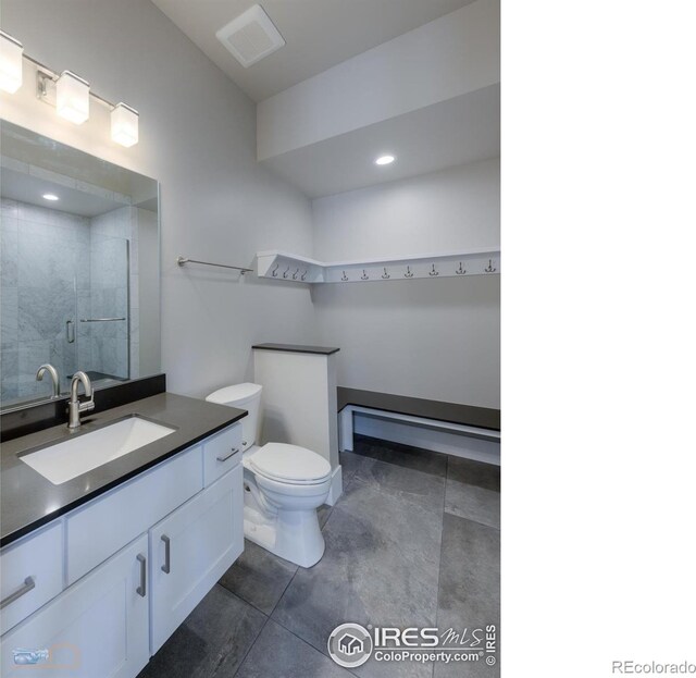 bathroom with visible vents, toilet, walk in shower, vanity, and recessed lighting