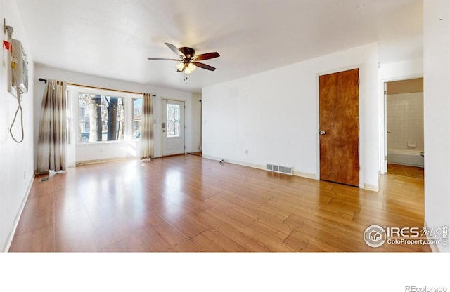 unfurnished room featuring ceiling fan and light hardwood / wood-style flooring