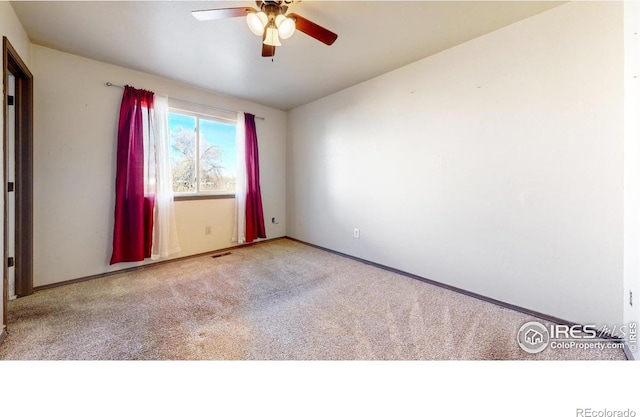 unfurnished room with light carpet and ceiling fan