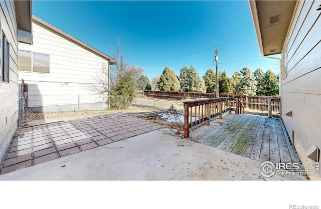 wooden deck featuring a patio area