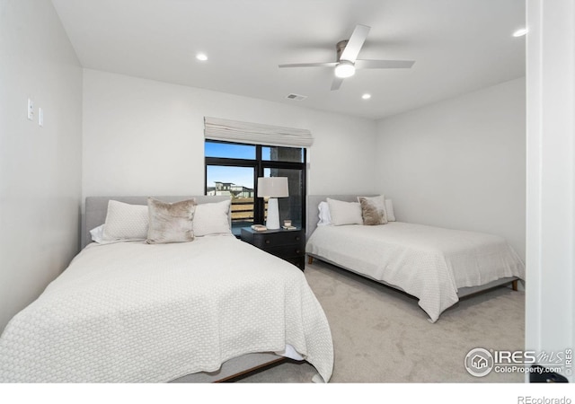 bedroom with ceiling fan and light colored carpet