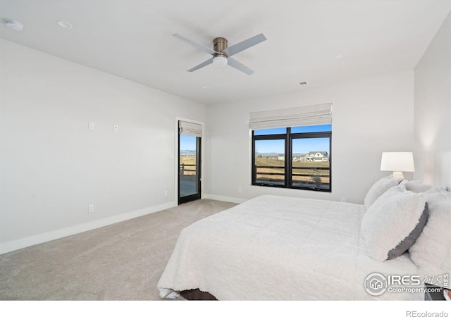 bedroom featuring access to exterior, light carpet, and ceiling fan