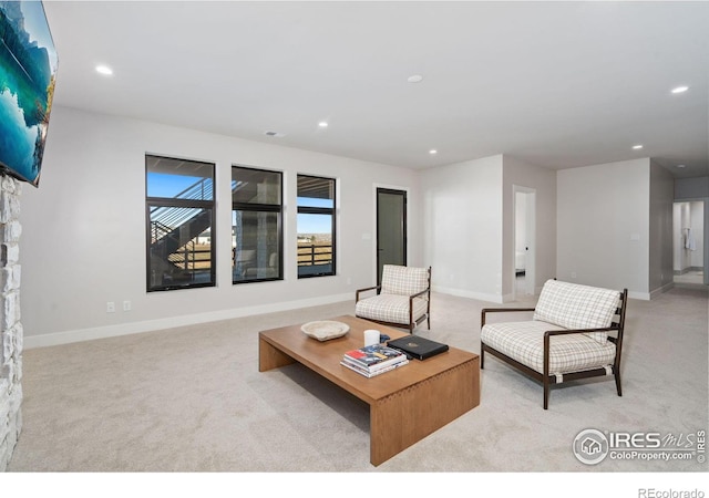 1722 Fire Glow Dr, Windsor, CO 80550 - carpeted living area featuring recessed lighting and baseboards