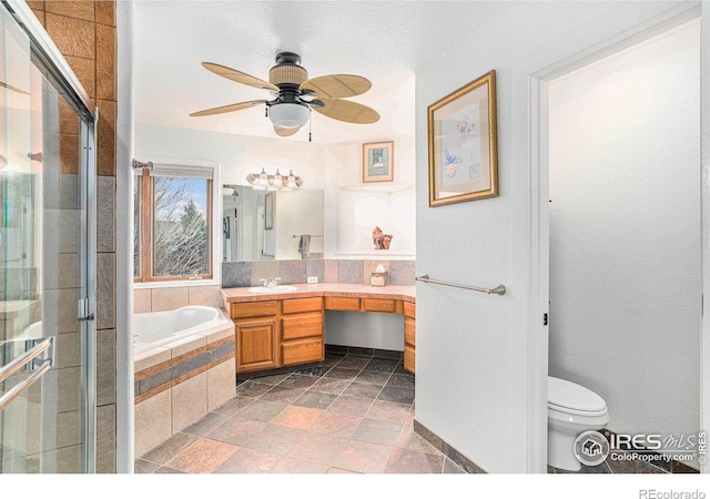 full bathroom featuring shower with separate bathtub, vanity, toilet, and ceiling fan