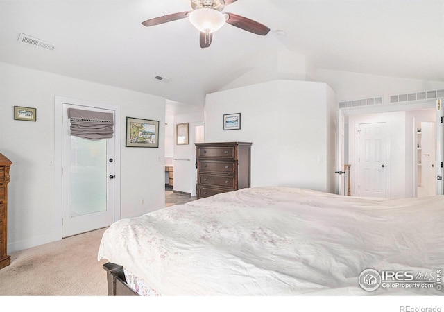 carpeted bedroom featuring ceiling fan and vaulted ceiling