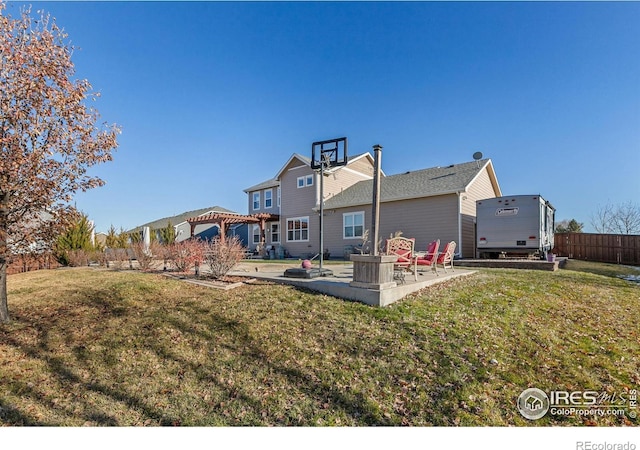 back of property featuring a yard, a patio, and a pergola