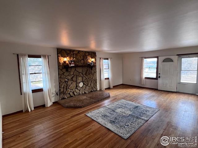 unfurnished living room featuring hardwood / wood-style floors