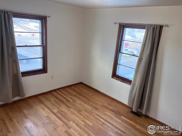 empty room featuring light hardwood / wood-style floors