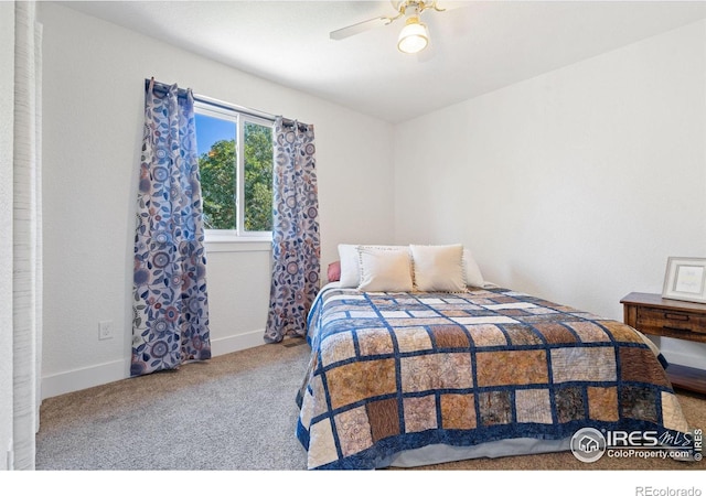 carpeted bedroom featuring ceiling fan