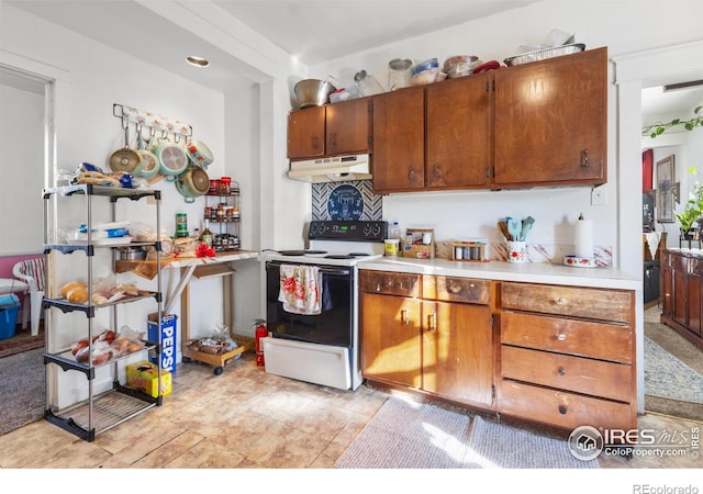 kitchen featuring white range with electric stovetop