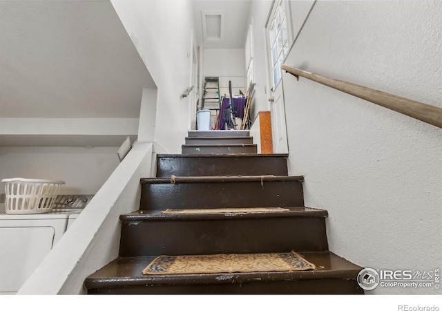 stairway with washer / clothes dryer