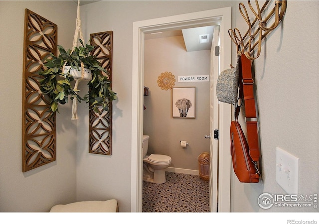 bathroom with tile patterned floors and toilet