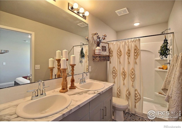 bathroom with vanity, a shower with curtain, and toilet