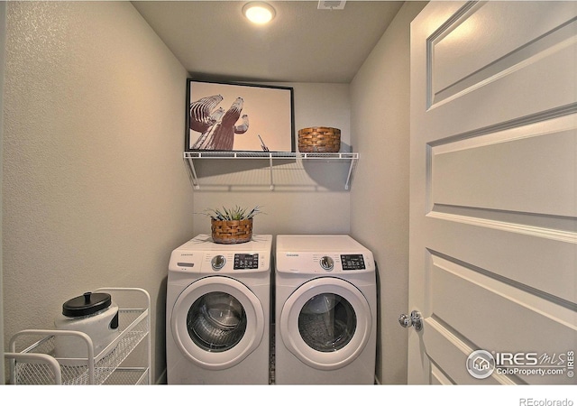 laundry room featuring washer and dryer