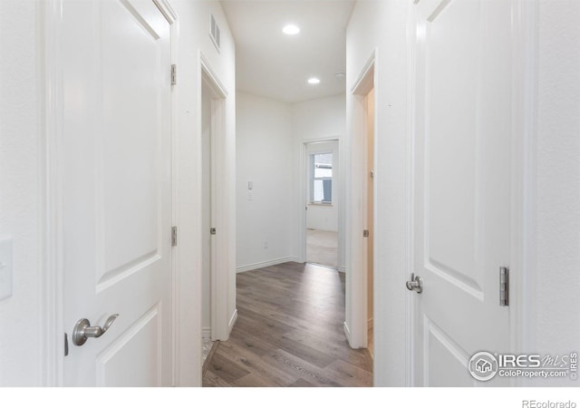 hallway with light wood-type flooring