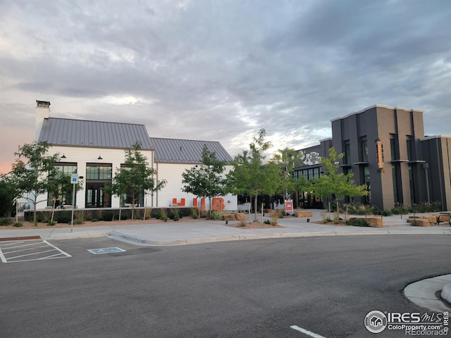 view of property with uncovered parking