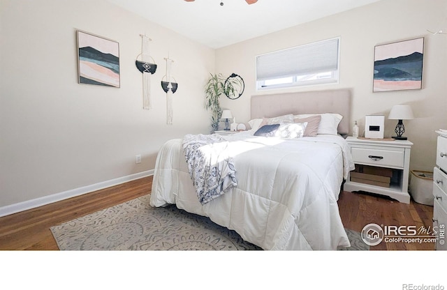 bedroom featuring ceiling fan and wood-type flooring