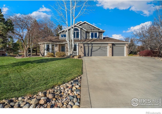 view of front property with a front yard and a garage