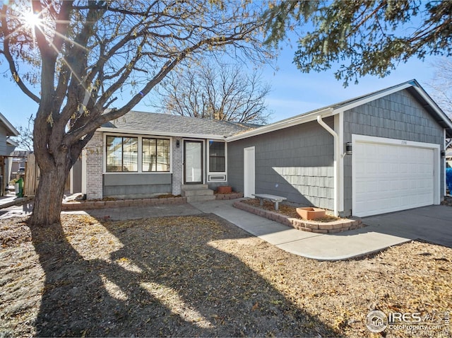 ranch-style house featuring a garage