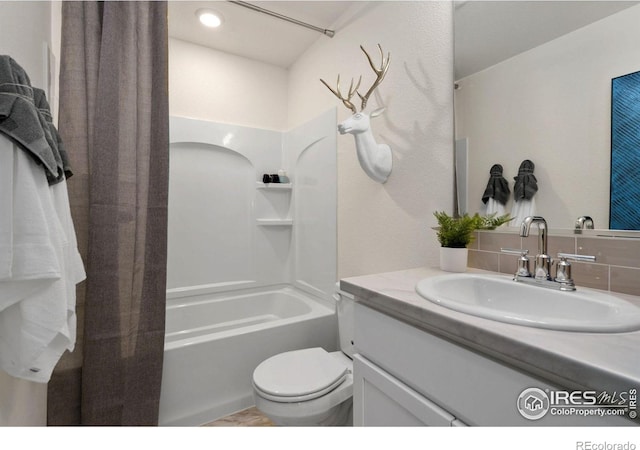 full bathroom featuring vanity, toilet, and shower / bath combo with shower curtain