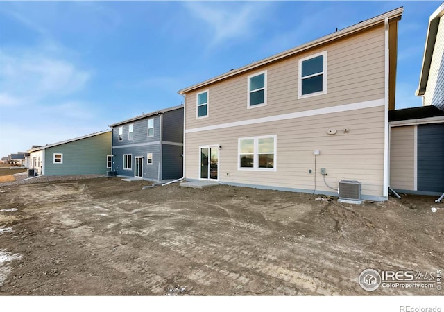 3218 Buffalo Grass Ln, Wellington, CO 80549 - rear view of house featuring central air condition unit