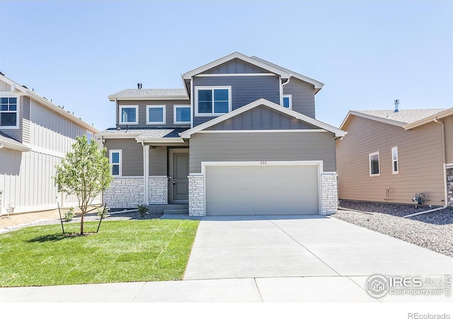 view of front of house featuring a garage and a front lawn