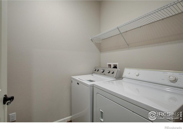 laundry area with washer and clothes dryer